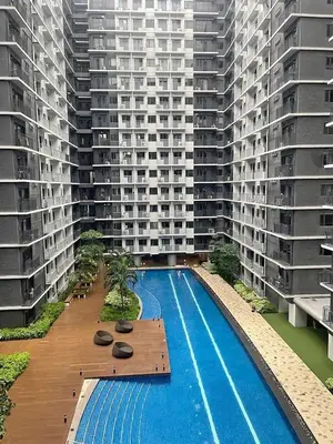 an overhead view of a large building with a swimming pool at Lilom in Manila