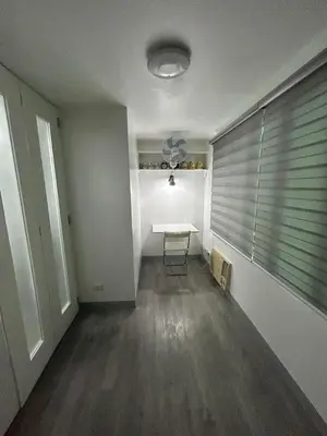 an empty room with a table and a window at Simple but cozy, feel at home in Manila