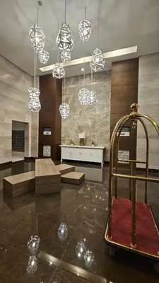 a large room with a lobby with chandeliers at The Radiance Manila Bay Staycation by SonPai in Manila
