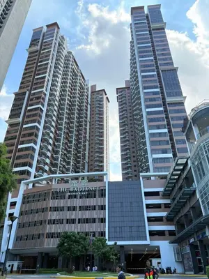 two tall skyscrapers in a city with buildings at The Radiance Manila Bay Staycation by SonPai in Manila