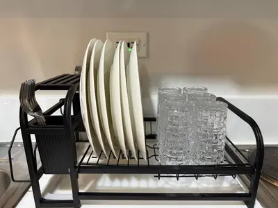 a rack with a bunch of surfboards and glasses at Iris Affordable and Neat Staycation at Air Residences Makati in Manila