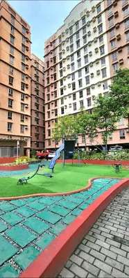 a park with a playground in front of a building at Avida Towers Sucat in Manila