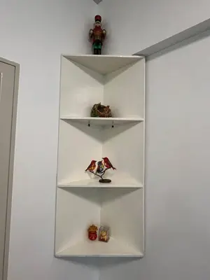 a white shelf with toy figurines on it at Marvinn's by LVH - 150 Newport Boulevard in Manila