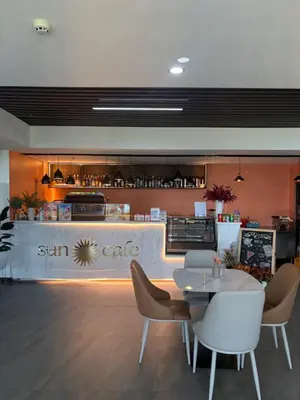 a restaurant with a table and chairs and a counter at Sybay suites near okada MOA airport NAIA COD Manila MSV1806H in Manila