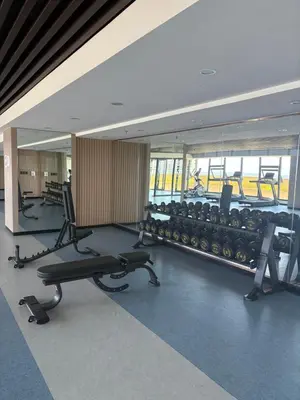 a gym with rows of exercise equipment in a building at Sybay suites near okada MOA airport NAIA COD Manila MSV1806H in Manila