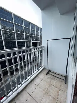 a room with a bunch of windows in a building at Minimalist Flat Retreat- Shore Residences in Manila