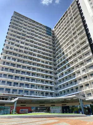 a large building with balconies on the side of it at Green 2 Residences Tower1 unit 512 in Dasmariñas
