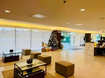 a living room with a christmas tree in a building at Green 2 Residences Tower1 unit 512 in Dasmariñas
