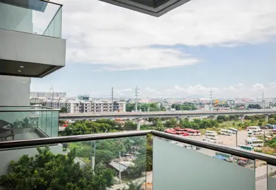 a view of a city from the balcony of a building at Grand Marina Residences in Manila