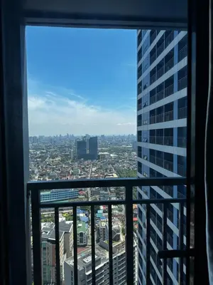 a view of a city from a skyscraper at MySunset at Air Residences Makati in Manila