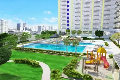 a large pool with a slide and a playground at 1 BR Family Condo near NAIA behind SM Sucat Paranaque Manila Philippines in Manila
