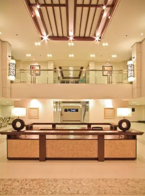 a large lobby with a reception desk in a building at 1 BR Family Condo near NAIA behind SM Sucat Paranaque Manila Philippines in Manila