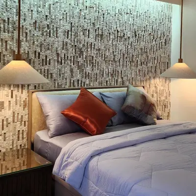 a bedroom with a bed with pillows on it at 29c BGC Cozy Suite Steps Away From Major Malls with Paid Parking and Gym with Fast Wi-fi in Manila