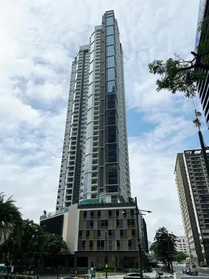 a tall building with a lot of windows at 29c BGC Cozy Suite Steps Away From Major Malls with Paid Parking and Gym with Fast Wi-fi in Manila