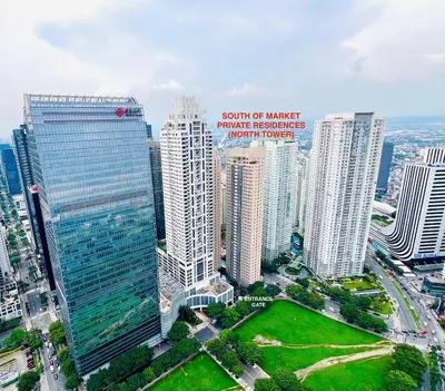 an aerial view of a city with tall buildings at Alex Staycation Home in BGC in Manila