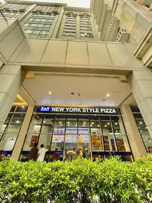 a store front of a new york style pizza at 101 Newport Blvd - SkyBison Aerie Condo Across NAIA T3 in Manila