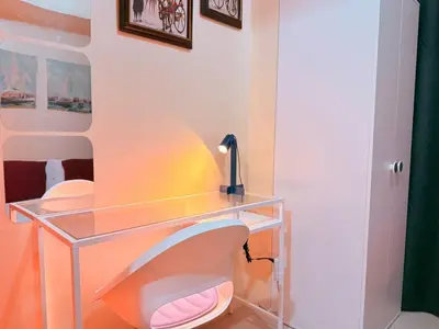 a bathroom with a glass desk and a sink at Cozy, budget-friendly stay for families and friends at Shell Residences by ONE Guest Place in Manila