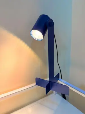 a blue lamp sitting on top of a table at Cozy, budget-friendly stay for families and friends at Shell Residences by ONE Guest Place in Manila
