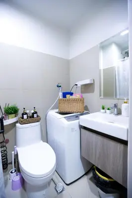 a bathroom with a toilet and a sink at Apartment near MOA & Airport in Manila