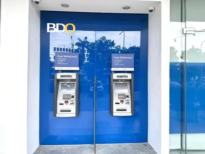 three atm machines in a blue door of a building at Apartment near MOA & Airport in Manila