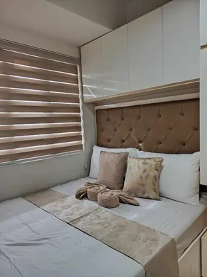 a bed with two towels on it in a bedroom at S Residences Room 910B near MOA, IKEA & NAIA by Prime Stay in Manila
