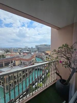 a balcony with a view of a city at Luxurious Balcony Venice Grand Canal View in Manila
