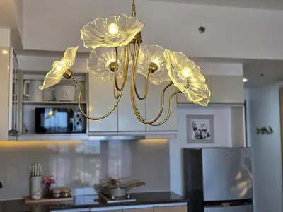 a chandelier with flowers on it in a kitchen at Luxurious Balcony Venice Grand Canal View in Manila