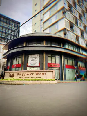 a building with a sign in front of it at Kai cabins SELF CHECK IN NEAR NAIA 1 & 2 in Manila
