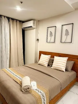 a bedroom with a large bed in a room at Kai cabins SELF CHECK IN NEAR NAIA 1 & 2 in Manila