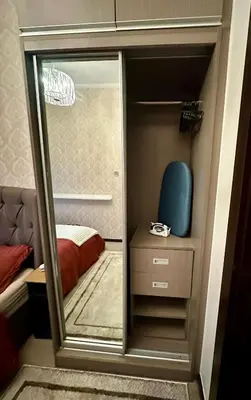 a small closet with a glass door leading to a bedroom at Stay at Downtown Suite 2 in BGC, Taguig City in Manila