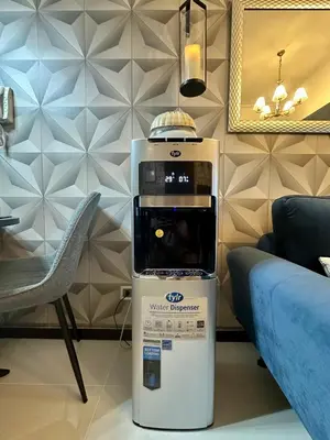 a coffee machine in a living room next to a couch at Stay at Downtown Suite 2 in BGC, Taguig City in Manila