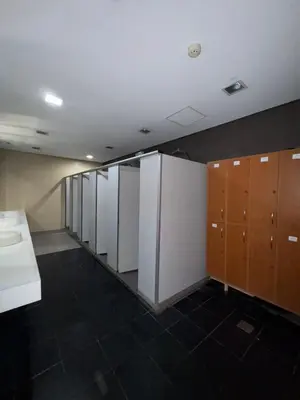 a row of lockers and cabinets in a room at La Casa Zen - Cozy Studio with private Wi-Fi, complimentary access to Fitness Centre, swimming pool and stunning city view located near the CBD of Ortigas, Makati, BGC in Manila