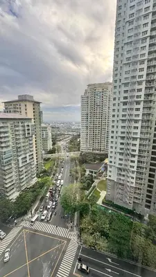 an aerial view of a city with tall buildings at Cozy Spacious BGC Condo near SM Aura, High Street in Manila