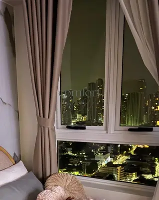 a window with a view of a city at Deluxe Cozy Room Near BGC & Ortigas with Balcony & City View in Manila
