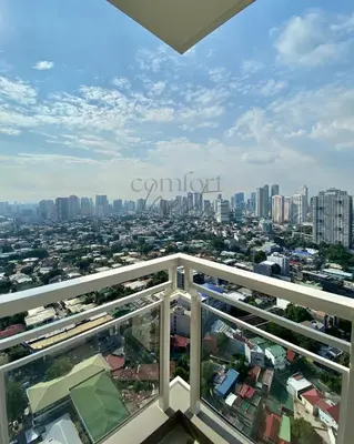 a view of the city from the balcony of a building at Deluxe Cozy Room Near BGC & Ortigas with Balcony & City View in Manila