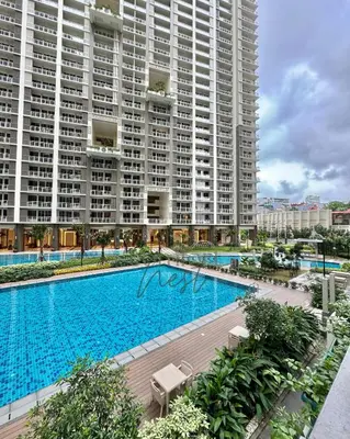 a large swimming pool in front of two large buildings at Deluxe Cozy Room Near BGC & Ortigas with Balcony & City View in Manila