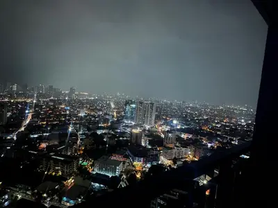 a view of a city at night with lights at Makati Stay Ph in Manila