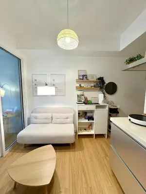 a living room with a couch and a table at Boracay by SIA in Manila