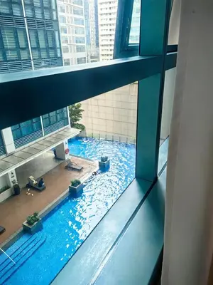 a view of a swimming pool in a building at Uptown BGC 1BR Modern Pool View Unit by Terravista in Manila