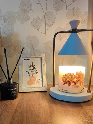 a desk with a lamp and a picture of a pineapple at Uptown BGC 1BR Modern Pool View Unit by Terravista in Manila