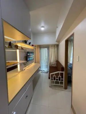 a kitchen with a sink and a counter top at Luxury Staycation at Shore 3 Mall of Asia in Manila