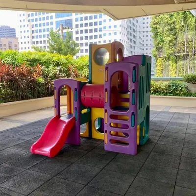 a childs play equipment in a building at Vanity Calm Bedroom in Ortigas Center in Manila