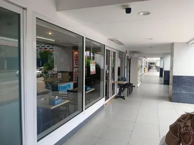 a hallway of a store with glass windows at Sea residences Christine prime in Manila