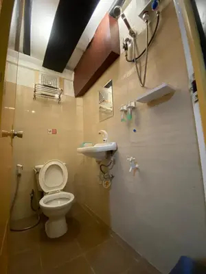 a bathroom with a toilet and a sink at Adorable - 2A, Chill Room in Manila