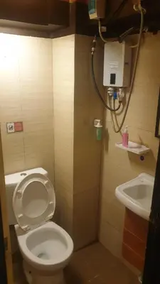 a bathroom with a toilet and a sink at Adorable - 2C, Love Nest Studio unit in Manila