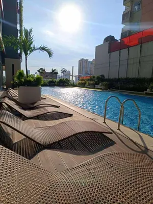 a swimming pool in a city with a resort at Red Residences in Manila