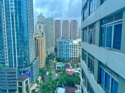 a view of a city with tall buildings at Pod to Go in Manila