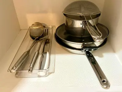 a mixer and utensils sitting on a counter at Casa Haraya Urban Stays - Walking Distance to NAIA Terminal 3 Newport City Condo with 500mbps WIFI and free Netflix access in Manila