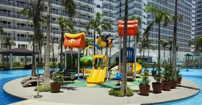 a playground at a resort with a slide at Staycation, Mall of Asia in Manila