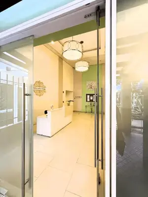 a hallway in a building with a glass door at JFam Suites, C4-11K Studio, Up To 4 Pax in Biñan